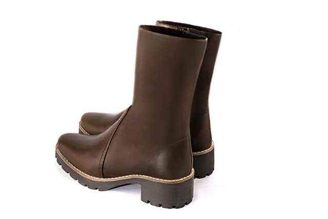 Dark brown women's ankle boots with a zip on the inside. Round toe. Low rubber soles. Rear view - Florence KOOIJMAN